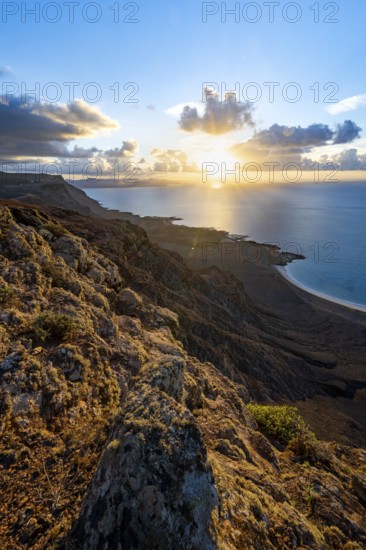 View of steep cliffs on sea and coast, Mirador del Porrito viewpoint at sunset, Lanzarote, Canary Islands, Spain
