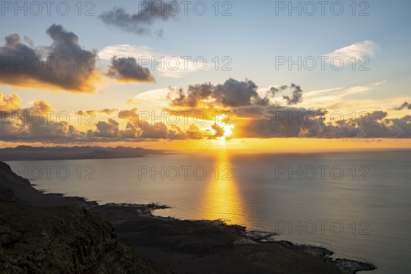 View of steep cliffs on sea and coast, Mirador del Porrito viewpoint at sunset, Lanzarote, Canary Islands, Spain