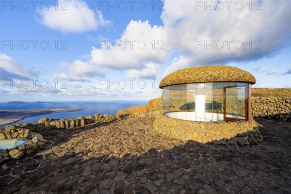 Staircase and viewing platform at the Mirador del RÃ­o viewpoint, in the evening light with sun stars, designed by artist César Manrique, Lanzarote, Canary Islands, Spain