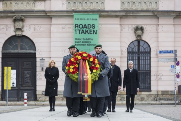 Wreath bearers carry wreaths in the Neue Wache, in the background Julia Klöckner (President of the German Bundestag), Friedrich Merz (Federal Chancellor) and Prof. Dr. Stephan Harbarth (President of the Federal Constitutional Court) in front of laying the wreath on Memorial Day at the Central Memorial of the Federal Republic of Germany for the Victims of War and Tyranny. Berlin, 16.11.2025