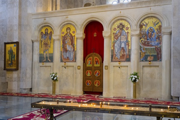 A magnificent church interior with mosaics and icons, candles standing in front of a decorated altar, Bagrati Cathedral, Church of the Dormition of the Most Holy Mother of God, UNESCO World Heritage Site, Kutaisi, Imereti Region, Georgia