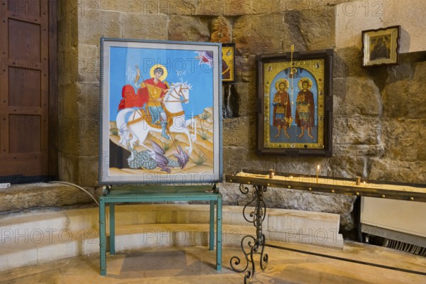 Two icons on a metal stand in a traditional church room with stone walls, Bagrati Cathedral, Church of the Dormition of the Most Holy Mother of God, UNESCO World Heritage Site, Kutaisi, Imereti Region, Georgia