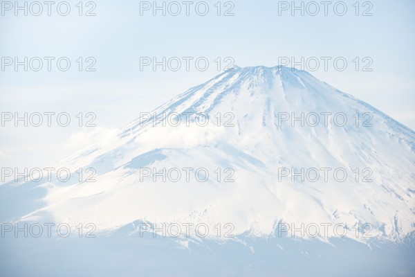 Snow-covered summit of Mount Fuji volcano in spring, ÅŒwakudani, Hakone, Japan