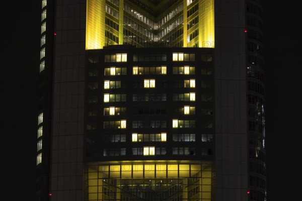 Lights inside the offices project a glowing yellow heart onto the faÃ§ade of the Commerbank Tower in Frankfurt am Main, Frankfurt am Main, Hesse, Germany
