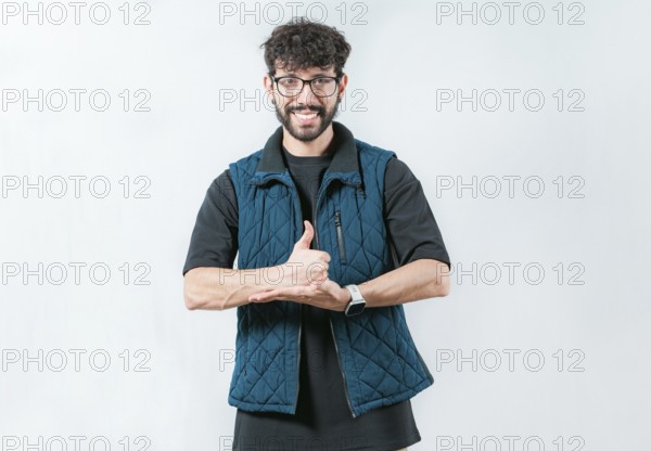 Person gesturing help with hands in nonverbal language. Smiling man showing help gesture with hands in sign language