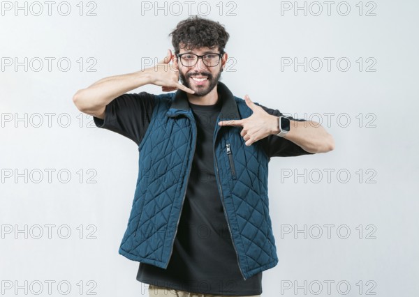Handsome man gesturing CALL ME in sign language isolated. Person making gesture CALLING in nonverbal language