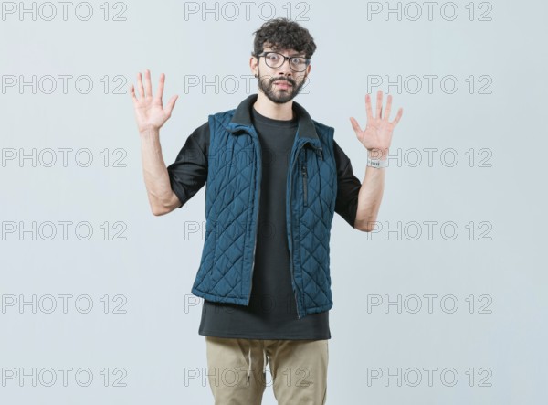 Person scared surprised with raised hands. Scared male with raised hands isolated
