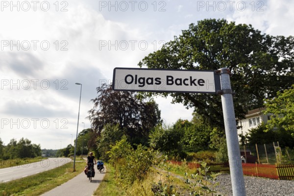 Funny street name, road sign with the inscription Olgas Backe, Kungsbacka, Hallands lÃ¤n, Sweden