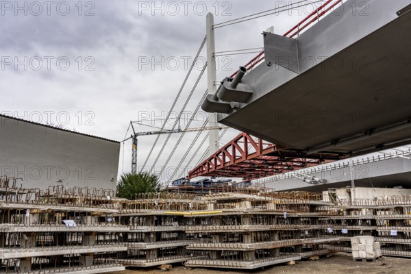 Storage space for building materials at the A40 Neuenkamp bridge, in Duisburg-Homberg, pillars and cables of the new motorway bridge across the Rhine near Duisburg, construction phase of the 2nd bridge structure, North Rhine-Westphalia, Germany