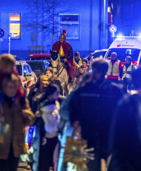Safety at the Martin train in Essen-RÃ¼ttenscheid, the parish of St. Lambertus, accompanied by police and rescue services, Saint Martin performer on a horse, with over 500 participants, North Rhine-Westphalia, Germany