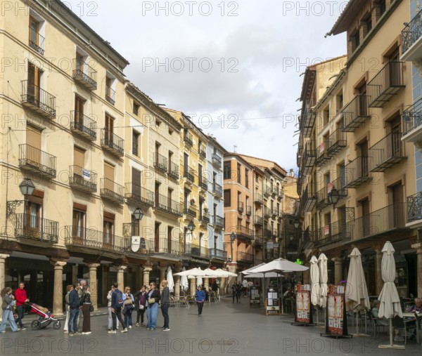 Historic buildings pedestrianised street Plaza Carlos Castel, leading off Plaza Torino, city centre square, Teruel, Aragon, Spain