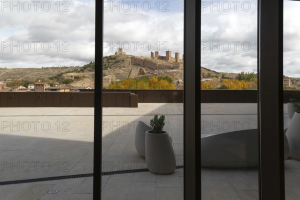 View of castle through glass windows of new Parador de Molina de AragÃ³n, Guadalajara province, Castile-La Mancha, Spain