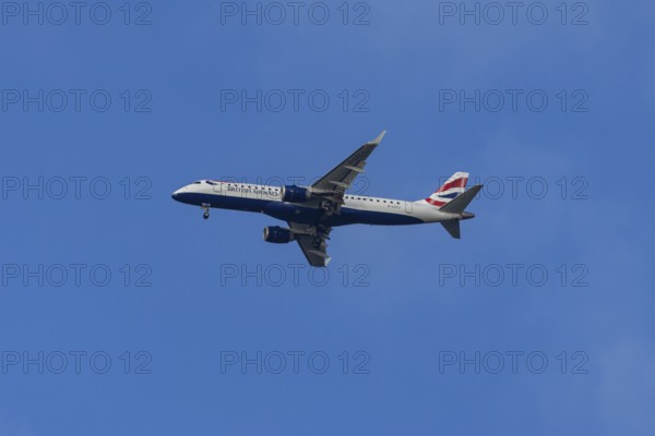 Embraer ERJ-190 jet passenger aircraft of British Airways BA CityFlyer airlines in flight on approach to London city airport, England, United Kingdom