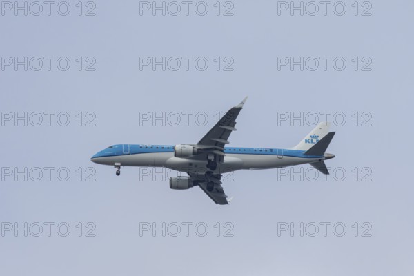 Embraer ERJ-190 jet passenger aircraft of Royal Dutch KLM cityhopper airlines in flight on approach to London city airport, England, United Kingdom