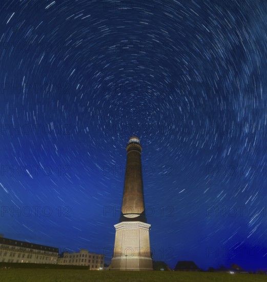 Starry sky above Borkum lighthouse Germany