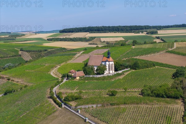 Pilgrimage church Maria im Weingarten, on a hill with surrounding fields under a blue sky, aerial view, near Volkach am Main, Lower Franconia, Mainfranken, Bavaria, Germany