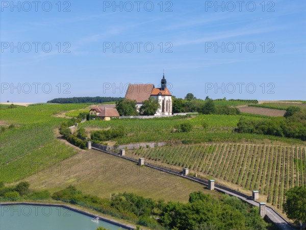 Pilgrimage church Maria im Weingarten, in a hilly, green landscape with blue sky, aerial view, near Volkach am Main, Lower Franconia, Mainfranken, Bavaria, Germany
