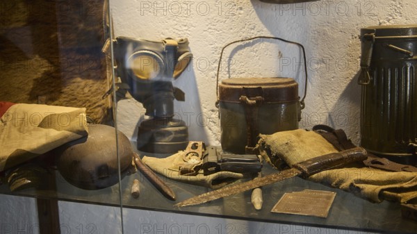 Display case with gas mask, helmet and other military collectibles, cookware, knife, pistol, war museum, military museum, private military museum, Platanos, Leros, WW2, Dodecanese, Greek Islands, Greece