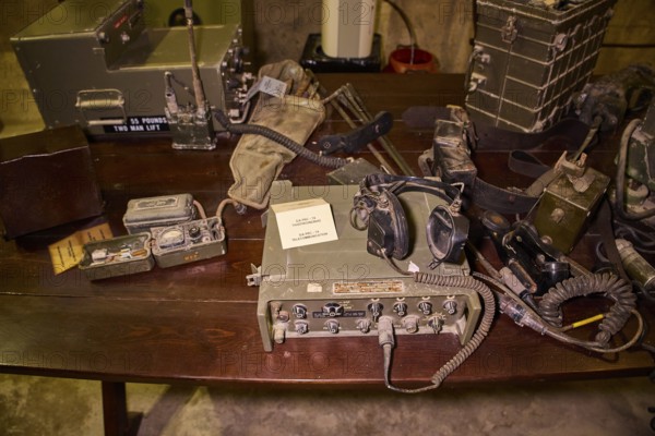 Antique military radio equipment and accessories displayed on a wooden table, War Museum, Military Museum, Tunnel Museum, Lakki, Leros, WW2, Dodecanese, Greek Islands, Greece