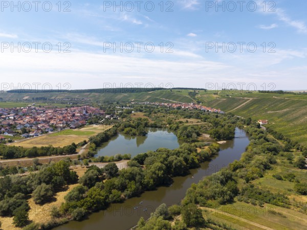 Wide river meandering through a green landscape with a village on the banks, Nordheim am Main, Mainfranken, Mainschleife, Franconia, Lower Franconia, Bavaria, Germany