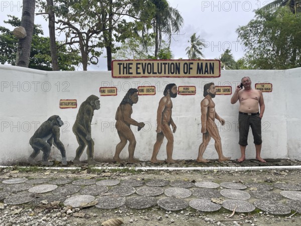 Evolution of anatomically modern man (Homo sapiens), parody, satire, funny, humour, mobile phone, phone call, Negros, Philippines, Negros, Philippines