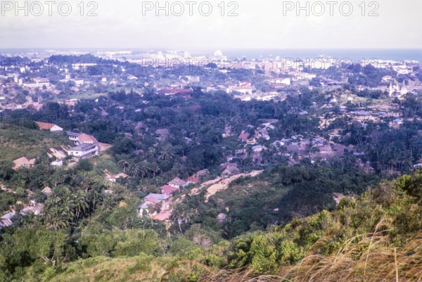 View over Bukit Purmei from Mount Faber towards city centre commercial area, Singapore, southeast Asia, 1965