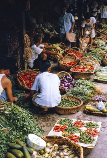 People shopping and stall holders vegetable market, Johor Bahru, Malaysia, Southeast Asia 1963