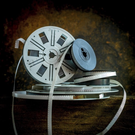 Old film strip reel showcasing vintage cinema history and its storytelling essence in a rustic environment