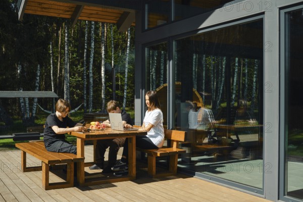 Woman develops mobile games and her sons are testing and refining the functionality and usability of prototypes