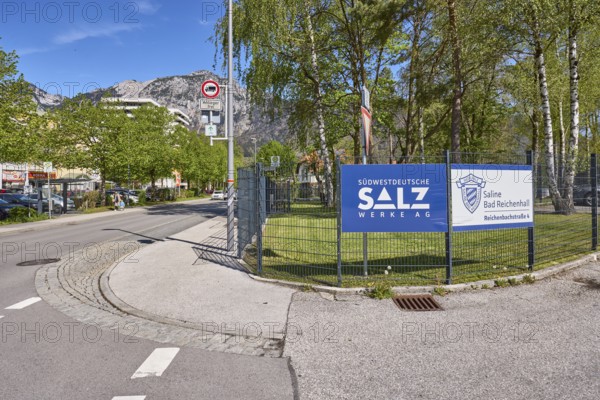 Südwestdeutsche Salzwerke AG, Bad Reichenhall salt works, metal fence, advertising sign, trees, lawn, general architecture, mountain landscape, mountains, road, blue sky, cirrostratus clouds, Reichenbachstrasse, Bad Reichenhall, Berchtesgadener Land district, Bavaria, Germany