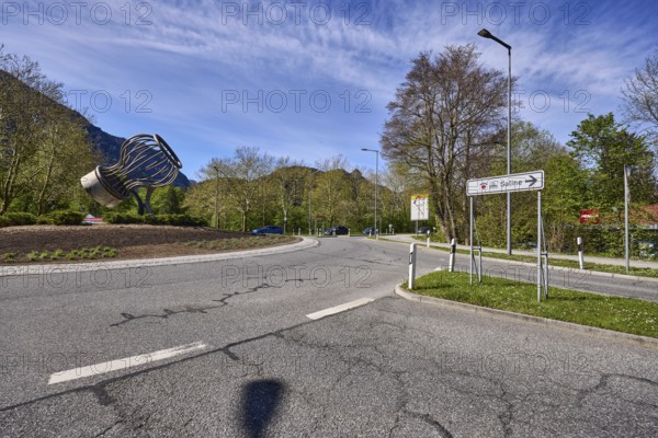 Salt works roundabout, stainless steel sculpture salt shaker, signpost to the salt works, streets, lantern, traffic island, trees, blue sky, cirrostratus clouds, roundabout, federal highway 20, Reichenbacher Straße, Bad Reichenhall, district Berchtesgadener Land, Bavaria, Germany