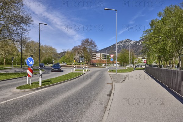 Road, traffic island, roundabout, lantern, metal railing, trees, lawn, mountain landscape, mountains, blue sky, cirrostratus clouds, federal road 20, Reichenbacher Straße, Bad Reichenhall, district Berchtesgadener Land, Bavaria, Germany