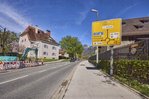 Signposts to Lofer, Inzell, Salzburg and Freilassing, road, house, lantern, trees, lawn, fenced-off building site, wall, wooden fence, blue sky, cirrostratus clouds, Reichenbachstraße, Bad Reichenhall, Berchtesgadener Land district, Bavaria, Germany