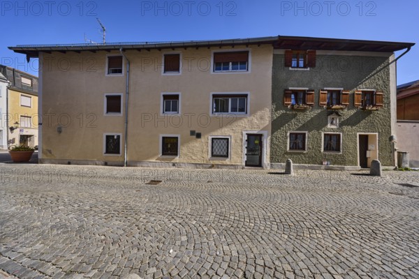 Historical buildings, houses, facade, windows, doors, alleyway, cobblestones, bollards, blue sky, cloudless, Sebastianigasse, Bad Reichenhall, Berchtesgadener Land district, Bavaria, Germany