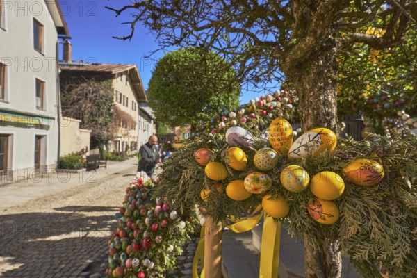 Easter fountain, Easter decoration, blown out coloured Easter eggs, historical building, depth of field, blue sky, cloudless, Florianiplatz, Bad Reichenhall, district Berchtesgadener Land, Bavaria, Germany