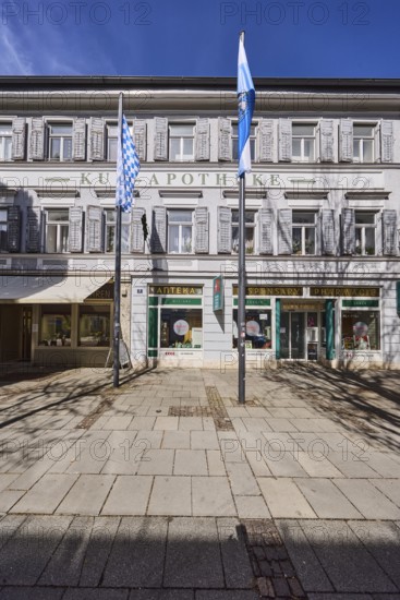 Kur-Apotheke, historical pharmacy, building, flagpoles, flags, facade, windows, entrance, doors, blue sky, cirrostratus clouds, Ludwigstraße, Bad Reichenhall, district Berchtesgadener Land, Bavaria, Germany