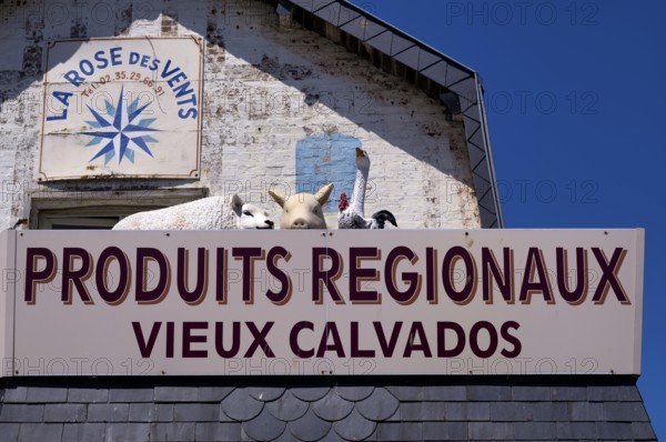 Advertising sign La Rose des Vents. Retail trade, supplier of regional products such as Calvados, advertising, advertising with figures, animal figures, sheep, pig, goose, rooster, Étretat, Normandy, Seine-Maritime, France