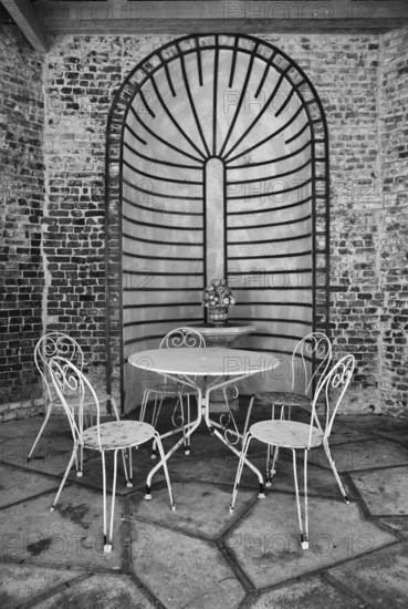 Seating area, seating group, rusty chairs, table, morbid, Maison Maurice Leblanc, museum in the garden and home of the writer known for Arsène Lupinus albus, black and white, Étretat, Normandy, Seine-Maritime, France