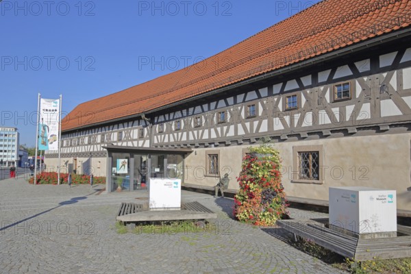 Entrance to the arms museum built in 1668, half-timbered house, banner, museum, Suhl, Franconia, Thuringia, Germany
