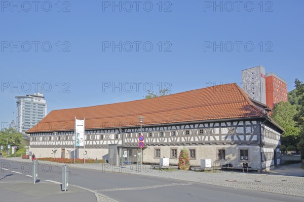 Armoury museum built in 1668, half-timbered house, museum, modern high-rise city hotel, Suhl, Franconia, Thuringia, Germany