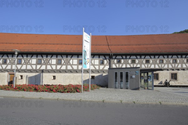 Entrance to the arms museum built in 1668, half-timbered house, museum, entrance, banner, Suhl, Franconia, Thuringia, Germany