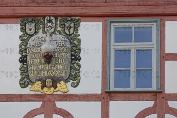 Monument with inscription : assembly house protestant, anno, roman, year, 1537, decorations, relief, church history, town history, detail, text, half-timbered, window, Lutherhaus, Schmalkalden