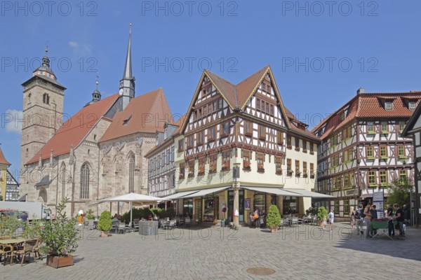 Late Gothic St George's Church and half-timbered houses with pedestrians, Altmarkt, Schmalkalden, Franconia, Thuringia, Germany