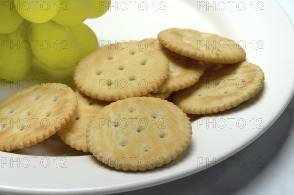 Crackers, crackers with grapes on a plate