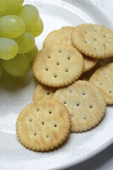 Crackers, crackers with grapes on a plate