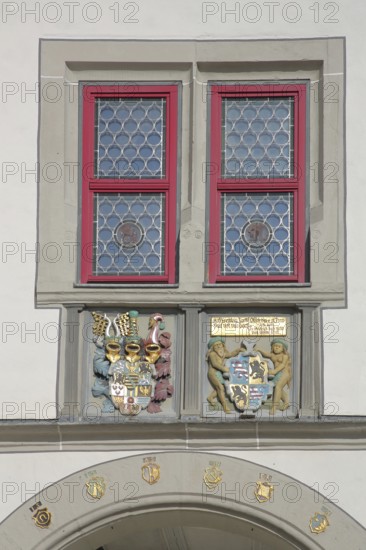 Historical town coat of arms with window on the town hall, detail, market square, Hildburghausen, Franconia, Thuringia, Germany
