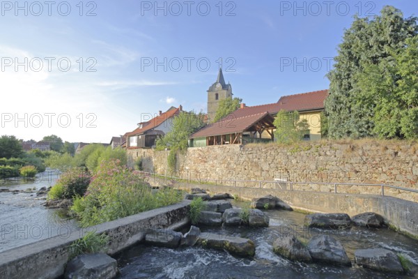 Werra with fish ladder, bank with stones, rocks, barrage, town wall, St Bartholomew's Church, Themar, cobblestone, Thuringia, Germany
