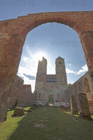 Romanesque St. Mary's Collegiate Church backlit with archway, twin towers, church ruins, interior view, view upwards, museum, Veßra Monastery, cobblestone, Thuringia, Germany