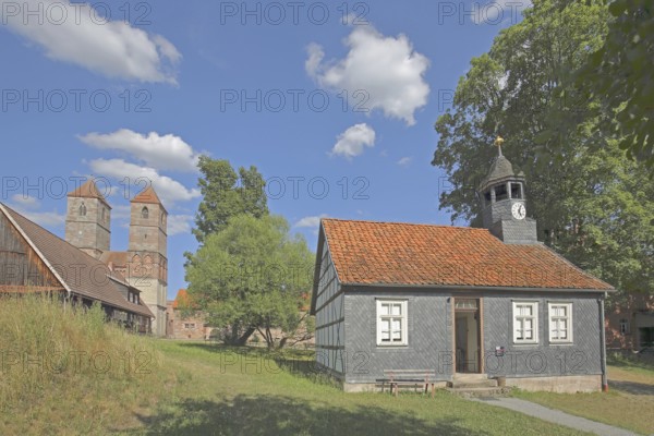 Parish hall with slate wall, spire and Romanesque St. Mary's Collegiate Church, church ruins, museum, Veßra Monastery, cobblestone, Thuringia, Germany