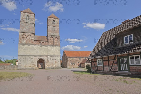 Romanesque St Mary's Collegiate Church with twin towers and half-timbered house, brick building, church ruins, museum, Veßra Monastery, cobblestone, Thuringia, Germany
